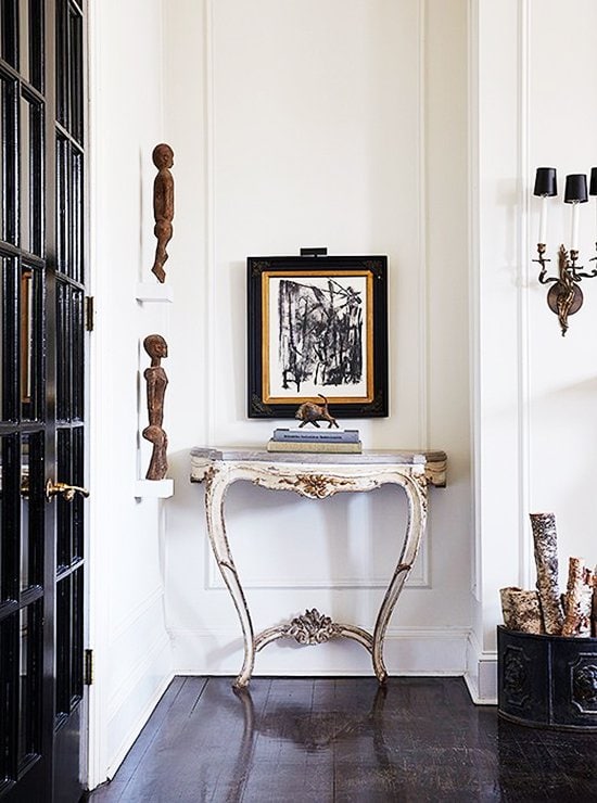 Stunning vignette with antique console table and abstract artwork in Darryl Carter home tour on Thou Swell @thouswellblog