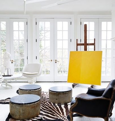 DARRYL CARTER'S NEUTRAL D.C. HAVEN 3 Stunning white sunroom with yellow painting and zebra rug on Thou Swell @thouswellblog