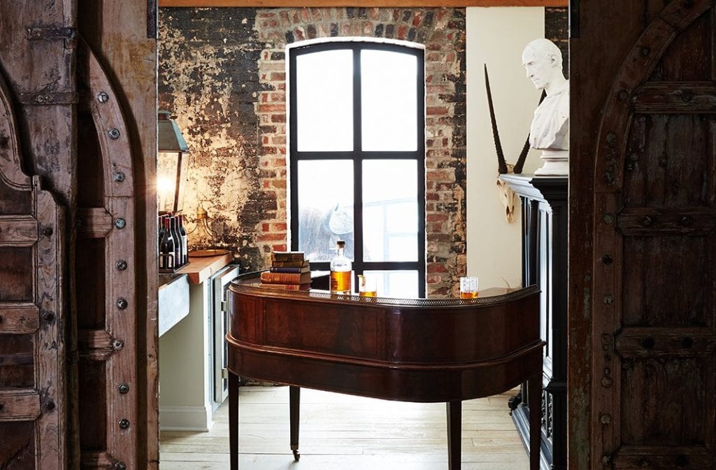 Stunning bar room with large paneled doors and brick walls on Thou Swell @thouswellblog