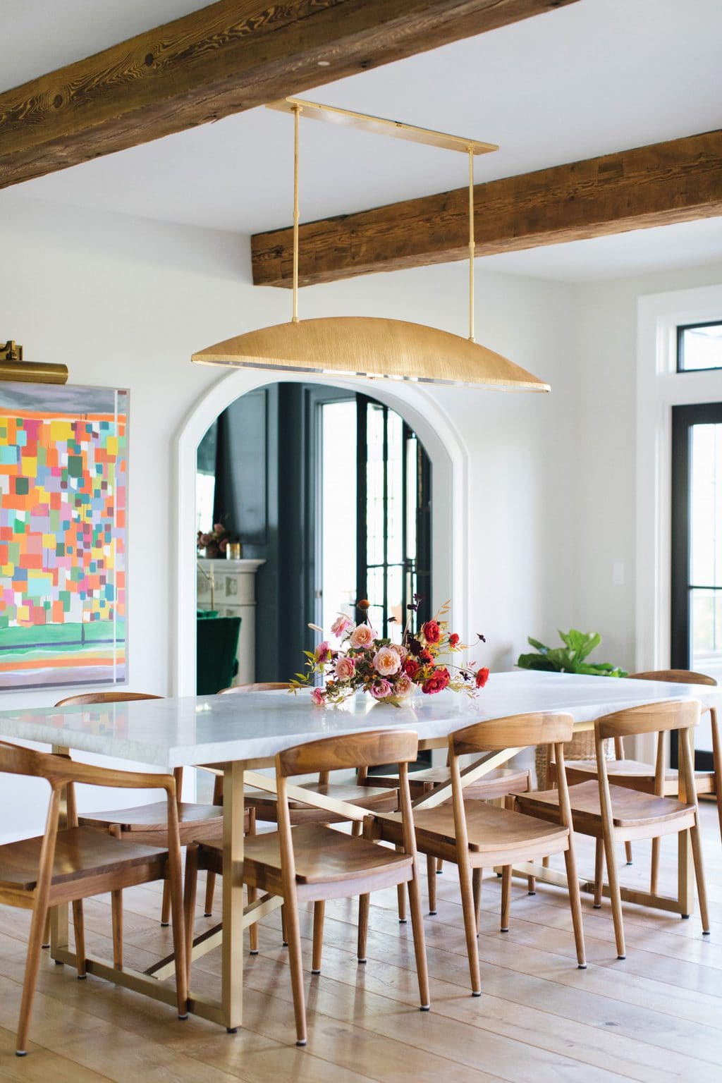 SHOP SHOWROOM BRANDS FROM HOME 19 Modern dining room with gold pendant light by Kelly Wearstler on Thou Swell @thouswellblog