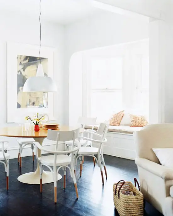 White dining room with dark stained hardwood and lacquered bentwood chairs on Thou Swell @thouswellblog