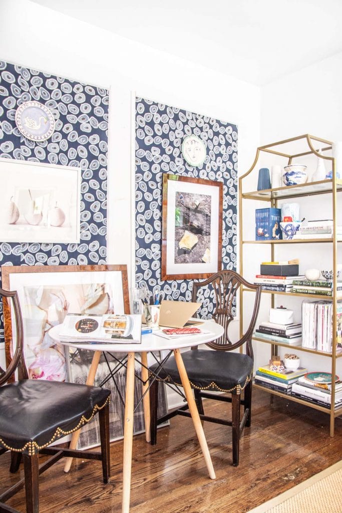 A more creative and inspiring workspace with blue wallpaper panels, modern white desk, and gold bookcase on Thou Swell @thouswellblog