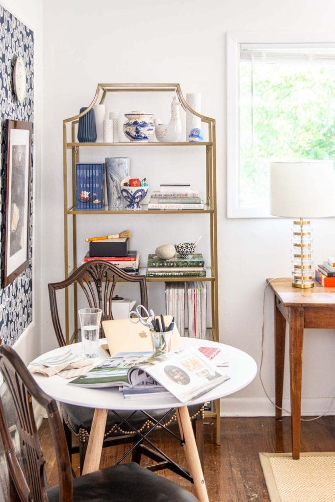 A more creative and inspiring workspace with blue wallpaper panels, modern white desk, and gold bookcase on Thou Swell @thouswellblog