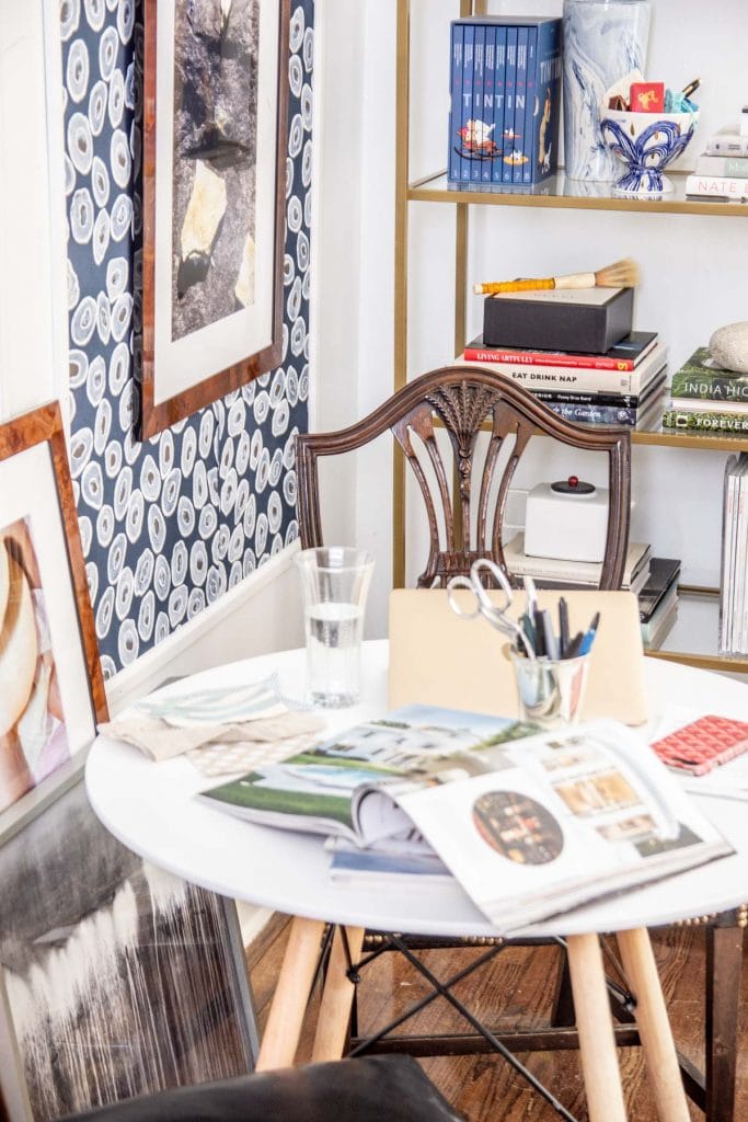 A more creative and inspiring workspace with blue wallpaper panels, modern white desk, and gold bookcase on Thou Swell @thouswellblog