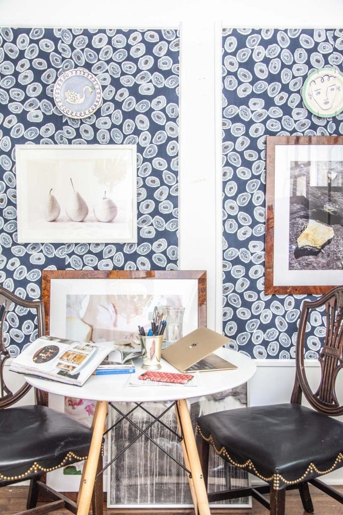 A more creative and inspiring workspace with blue wallpaper panels, modern white desk, and gold bookcase on Thou Swell @thouswellblog