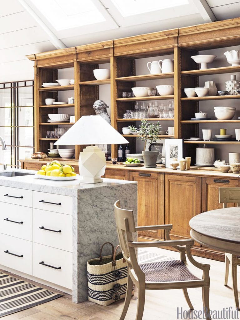 Modern farmhouse kitchen with wood open shelf cabinetry and marble island with table lamp on Thou Swell @thouswellblog