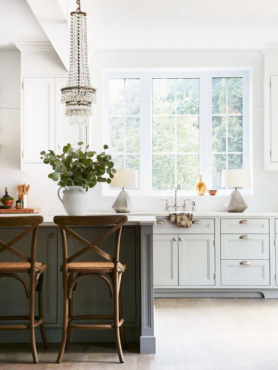 Rustic chic kitchen with crystal chandelier and table lamps beside the sink on Thou Swell @thouswellblog