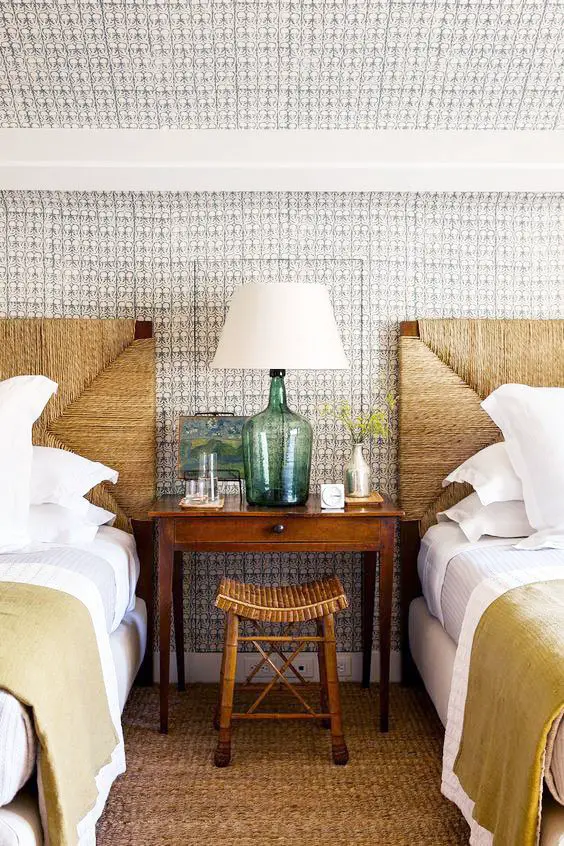 A classic, coastal twin bedroom with wicker headboards and a sea glass lamp on Thou Swell @thouswellblog