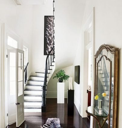 BLENDING TREND AND TRADITION IN NEW ORLEANS 11 Traditional entryway in New Orleans with gold mirror and zebra rug on Thou Swell @thouswellblog