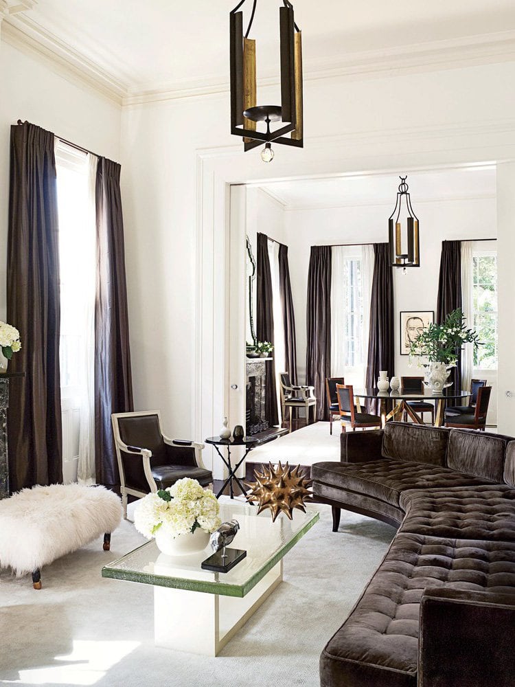 Chic brown and white living room in New Orleans with curved sectional on Thou Swell @thouswellblog