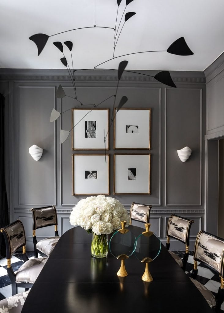 Dark grey dining room with mobile in Ryan Korban townhouse on Thou Swell #ryankorban #diningroom #diningroomdesign #interiordesign #greydiningroom #greyroom #greywalls #townhouse #interiordesign