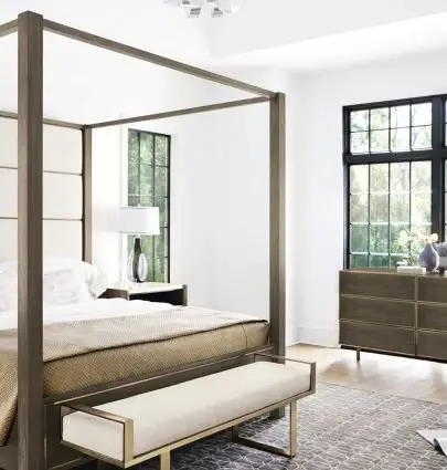Airy contemporary bedroom with sleek modern bench and canopy bed on Thou Swell @thouswellblog