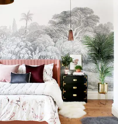 Tropical bohemian bedroom makeover with pink velvet bed and black campaign nightstand on Thou Swell @thouswellblog