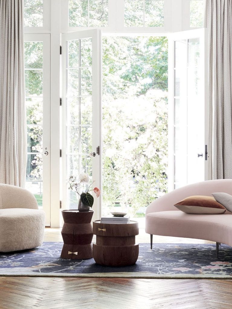 Pale pink curved sofa and chinoiserie rug in CB2 x goop collection on Thou Swell @thouswellblog