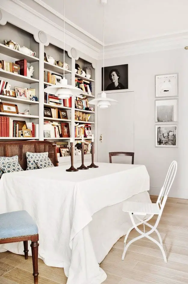 Dining room with hidden door and library bookshelves on Thou Swell @thouswellblog