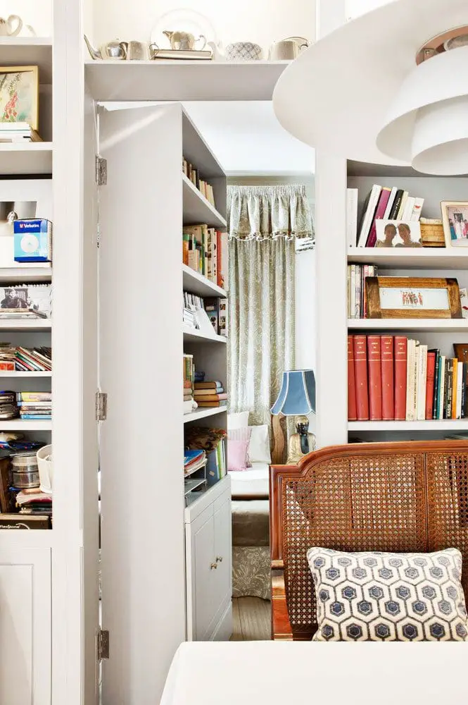 Dining room with hidden door and library bookshelves on Thou Swell @thouswellblog