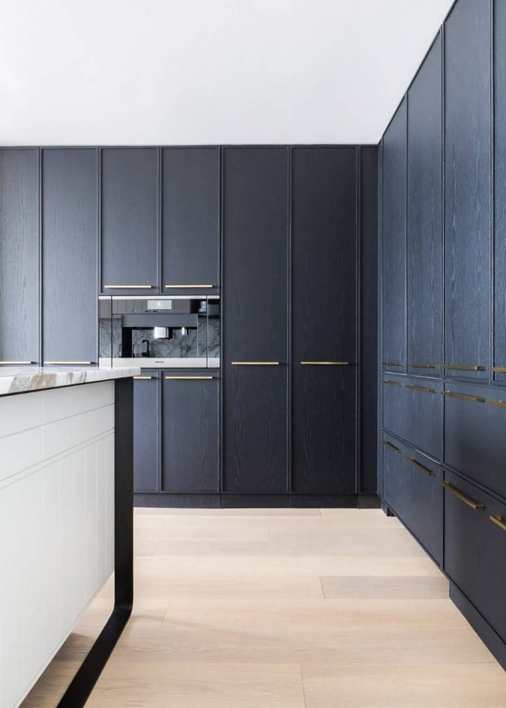 Kitchen with black cabinets and hidden storage on Thou Swell @thouswellblog