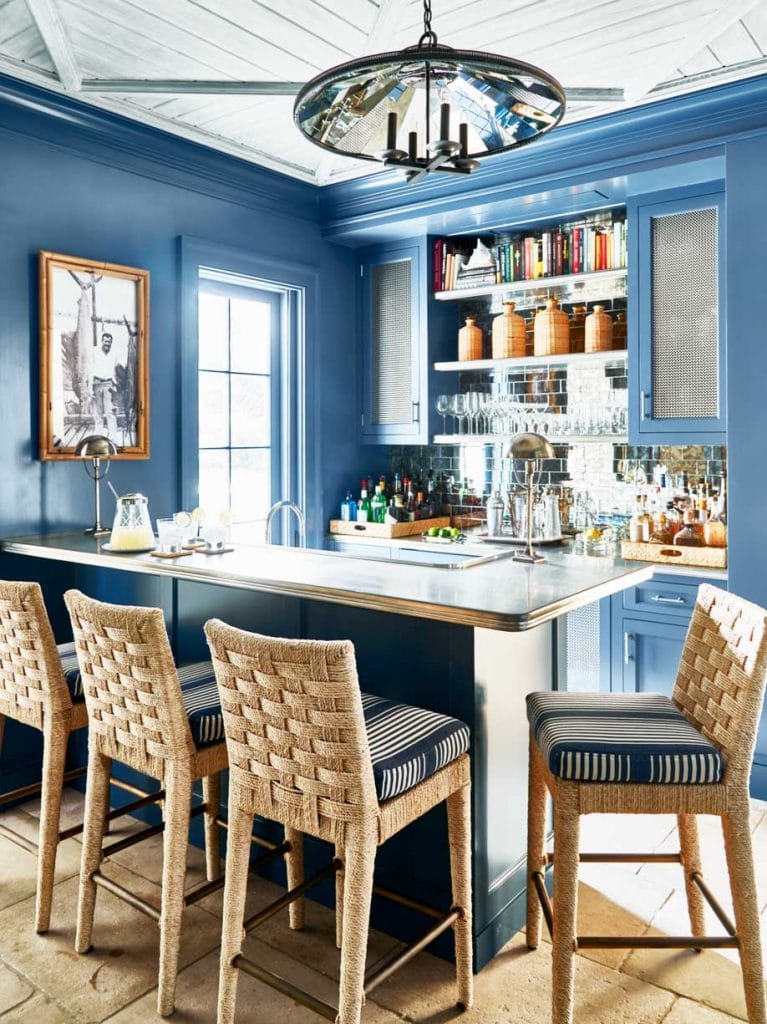 Blue bar with wicker counter stools in Palm Beach house on Thou Swell #hometour #palmbeach #bar #coastaldecor