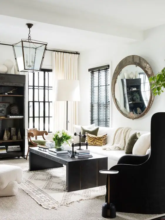 Ryan Hughes home in Midtown Atlanta, black and white living room with mirror and lantern #livingroom #livingroomdesign #atlantahome #atlantahomes