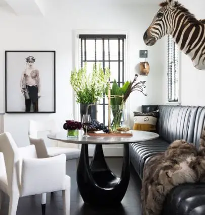 Ryan Hughes home in Midtown Atlanta, dining room with faux zebra head and banquette seating #diningroom #atlantahome #housetour #moderndiningroom