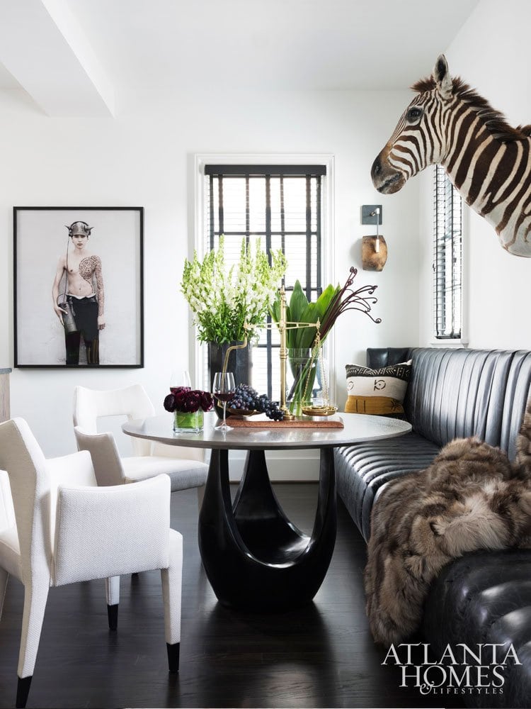 Ryan Hughes home in Midtown Atlanta, dining room with faux zebra head and banquette seating #diningroom #atlantahome #housetour #moderndiningroom