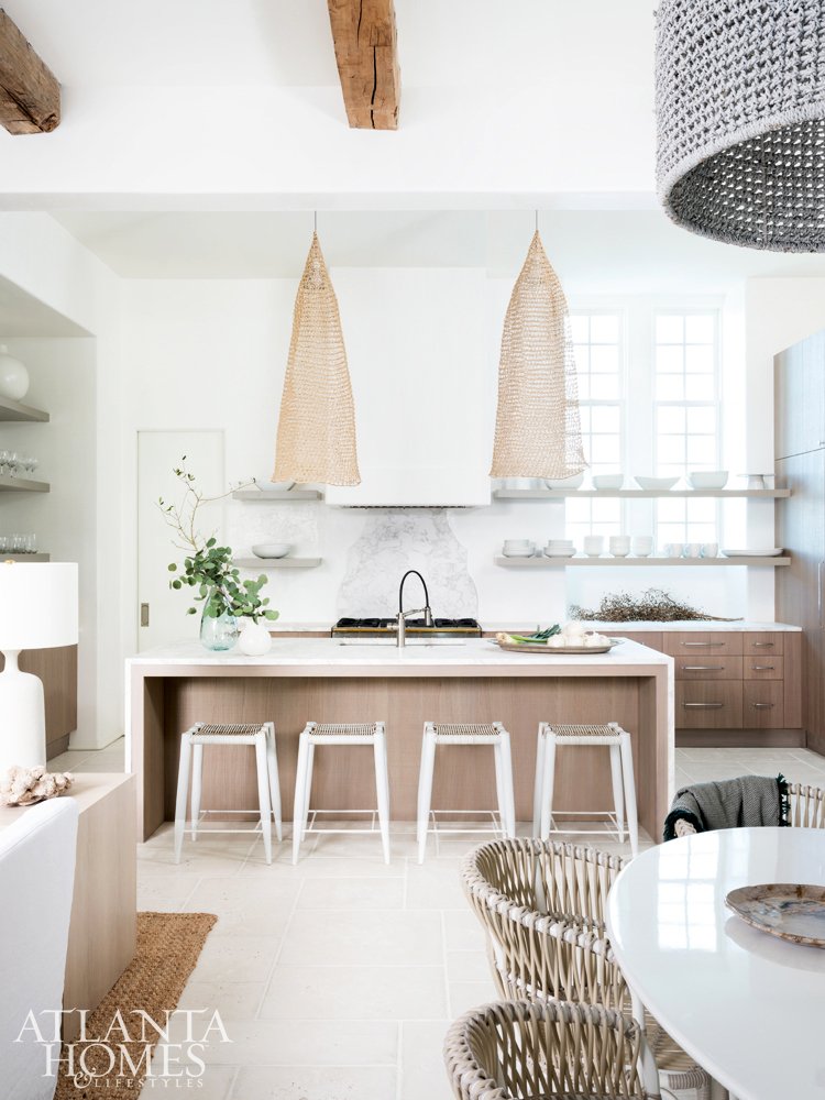 Modern coastal kitchen design in Alys Beach home with wicker pendants on Thou Swell #coastal #coastaldesign #coastalkitchen #modernkitchen #kitchendesign #kitchen