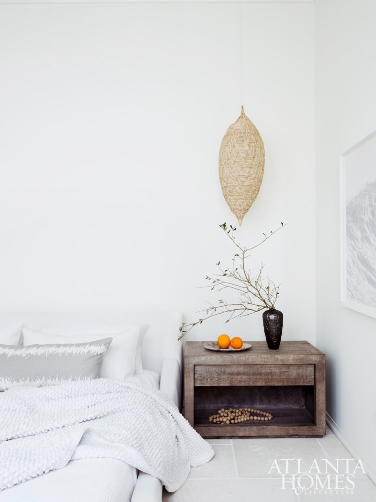 Minimal beach bedroom with wicker pendant light on Thou Swell #coastaldesign #coastal #bedroom #bedroomdesign