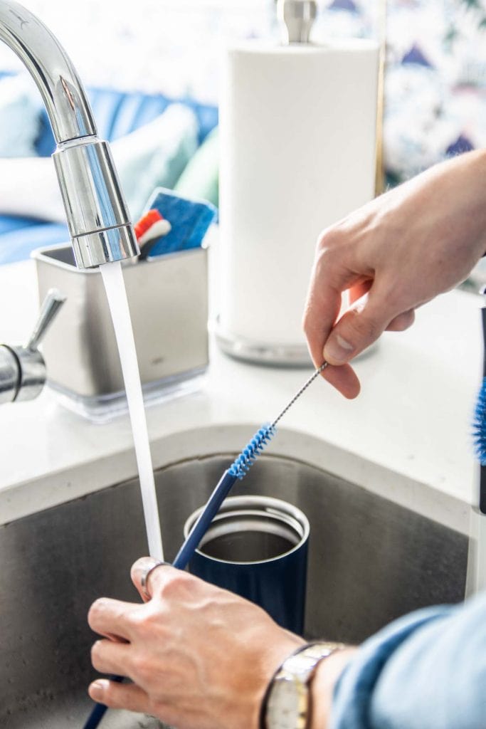 Spring cleaning in a modern kitchen design with @oxo cleaning tools on Thou Swell AD #oxobetter #springcleaning #kitchen #kitchendesign 