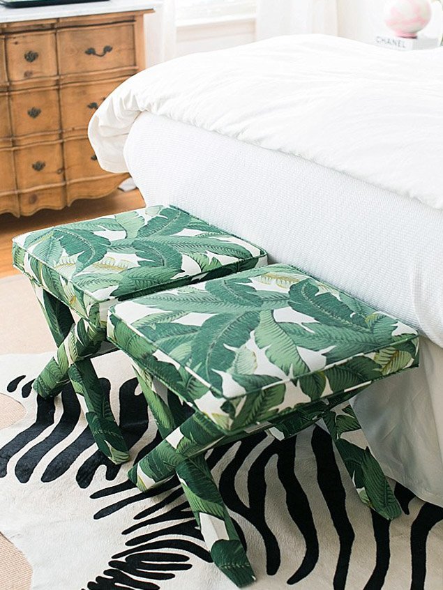 Fun tropical bedroom design with palm leaf print x bench and zebra hide rug on Thou Swell #bedroom #tropicaldesign #tropicalbedroom #bedroomdesign #xbench #zebrarug