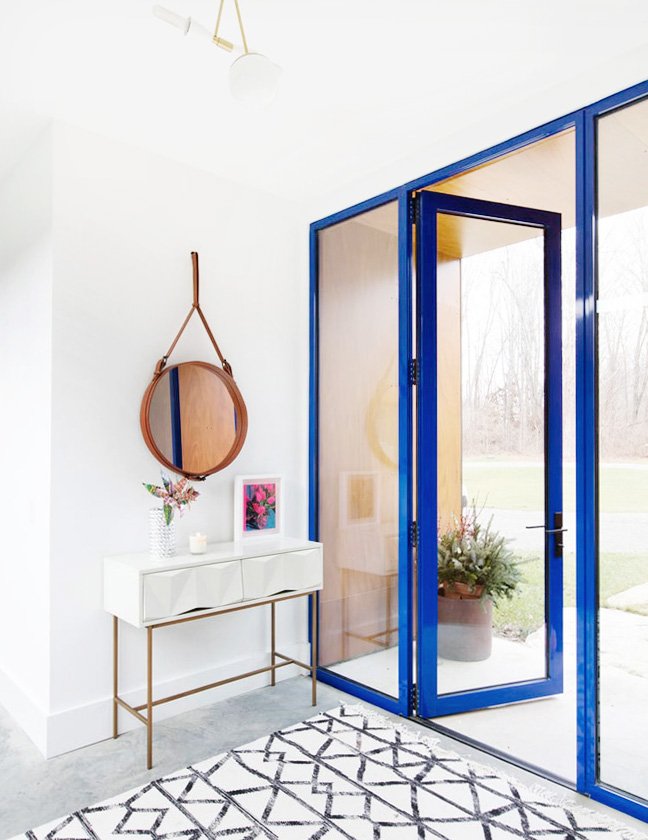 Blue and white entryway with modern doors on Thou Swell #entryway #entry #entrydesign #blue #blueandwhite #modern