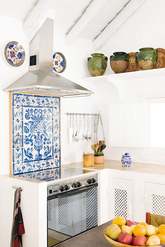 Blue and white tile in a kitchen in Portugal on Thou Swell #portugal #kitchen #kitchendesign #blueandwhite #tile #portuguesetile #coastalkitchen