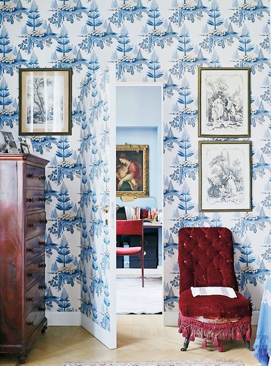 Blue and white wallpaper with jib door in an Italian apartment on Thou Swell #italiandesign #italianapartment #blueandwhite #blueandwhitewallpaper #wallpaper #hiddendoor #jibdoor #interiordesign