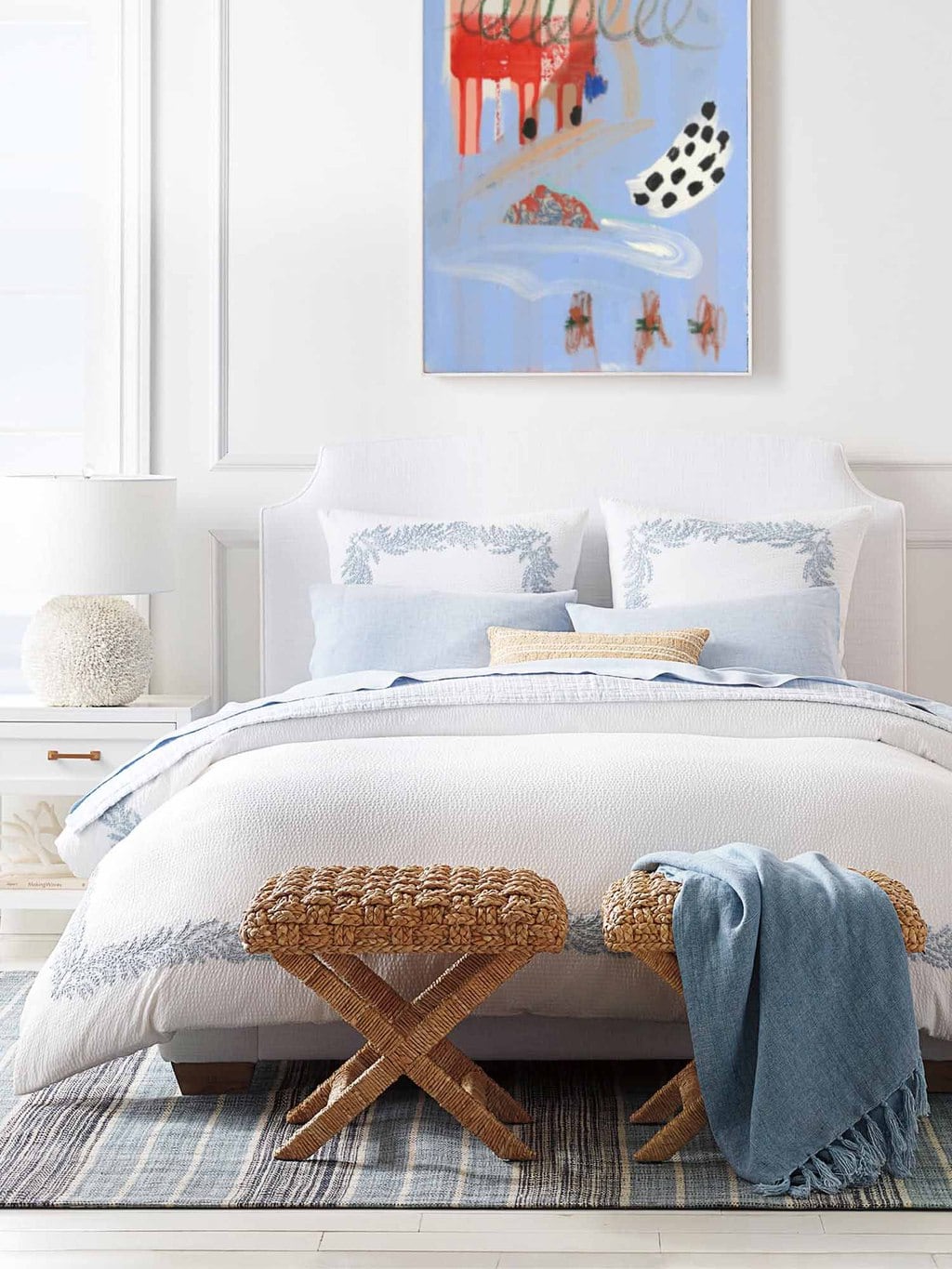 Classic blue and white bedroom design with wicker x bench at foot of bed by Serena & Lily on Thou Swell #bedroom #bedroomdesign #wicker #wickerbench #xbench