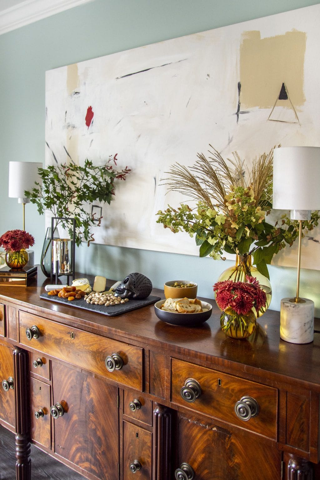 A CHIC HALLOWEEN VIGNETTE FOR EASY ENTERTAINING 20 Chic halloween party decor with flowers and cheese board by Kevin O'Gara on Thou Swell #halloween #halloweenparty #halloweendecor #halloweenflowers #cheeseboard #cheese #flowers #partydecor #party #decor #decorideas