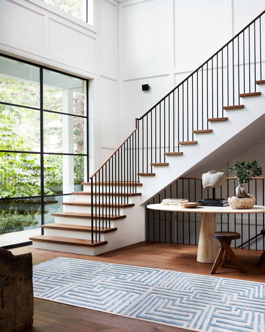 LATEST PINS x KFD LABYRINTH RUGS 1 Huge stair landing entryway design with iron balusters and blue Knossos maze rug runner in Sky by Kevin Francis Design on Thou Swell #arearug #rug #rugdesign #mazerug #maze #luxuryrug #tuftedrug #woolrug #patternedrug #homedecor #homedecorideas #luxurydesign