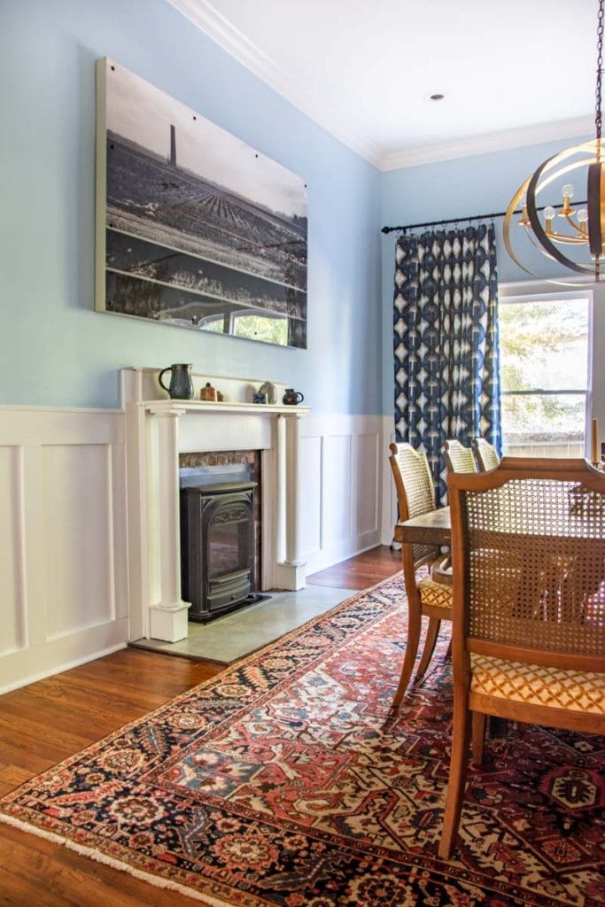 Light blue dining room (Behr Rain Dance) with white flat panel wainscoting (Behr Sleek White) before and after makeover by Kevin O'Gara on Thou Swell #diningroom #diningroomdesign #diningroommakeover #beforeandafter #diypaneling #diymoulding #bluepaint #painting #wainscoting