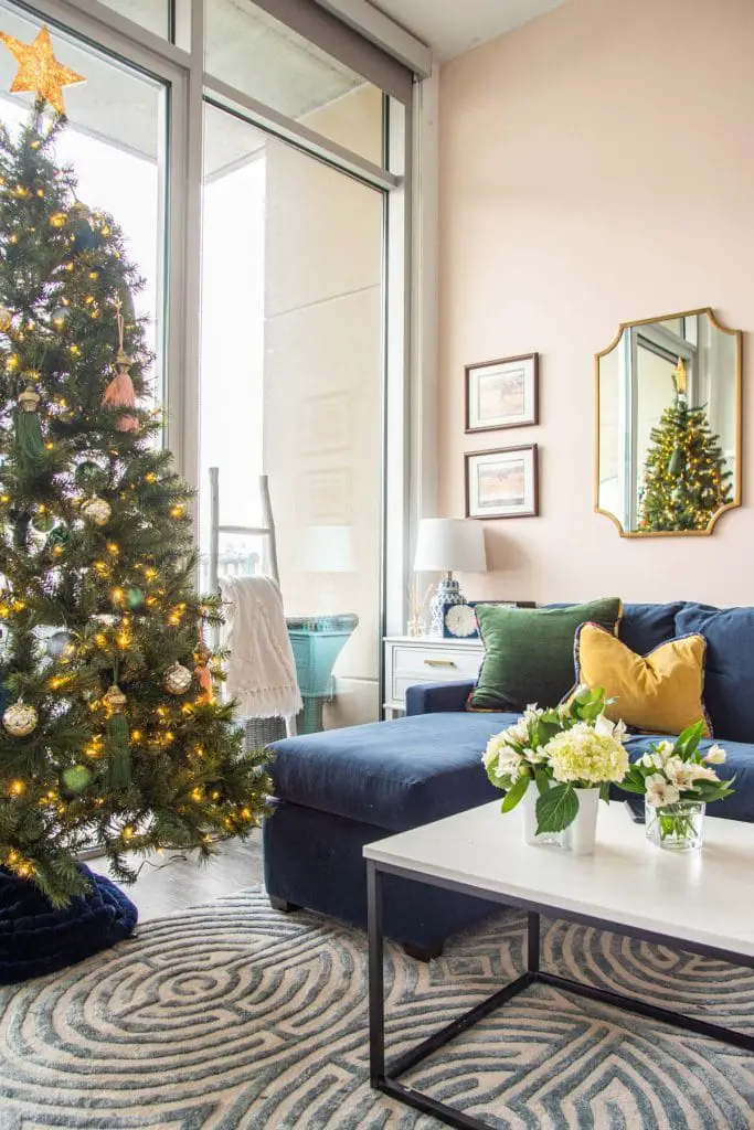 Jewel-tone Christmas tree holiday decor with tassels and boho style from SmithHönig in apartment living room by Kevin O'Gara on Thou Swell #christmas #christmastree #christmasdecor #holidaydecor #bohodecor #bohochristmas #tassels #smithhonig #apartment #apartmentdecor #livingroomdesign