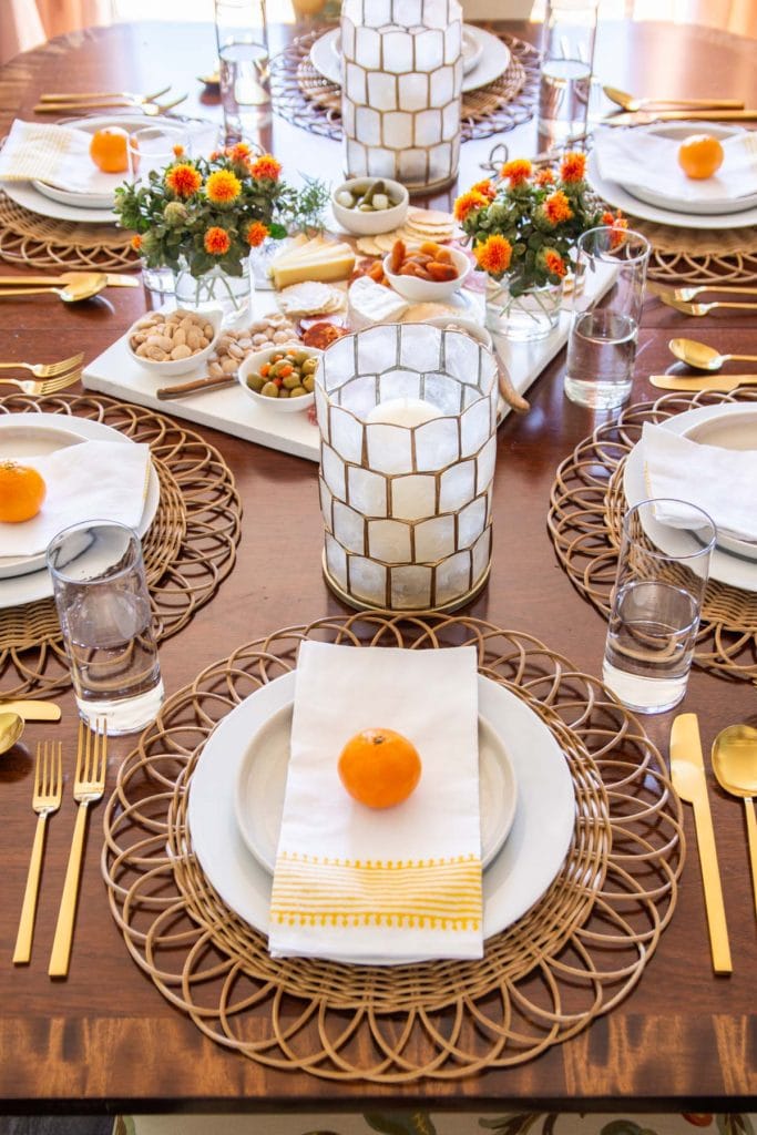 A fresh and approachable Thanksgiving table with Serena & Lily rattan placemats and decor by Kevin Francis O'Gara #thanksgiving #tablesetting #tablescape #thanksgivingtable #thanksgivingdecor #serenaandlily