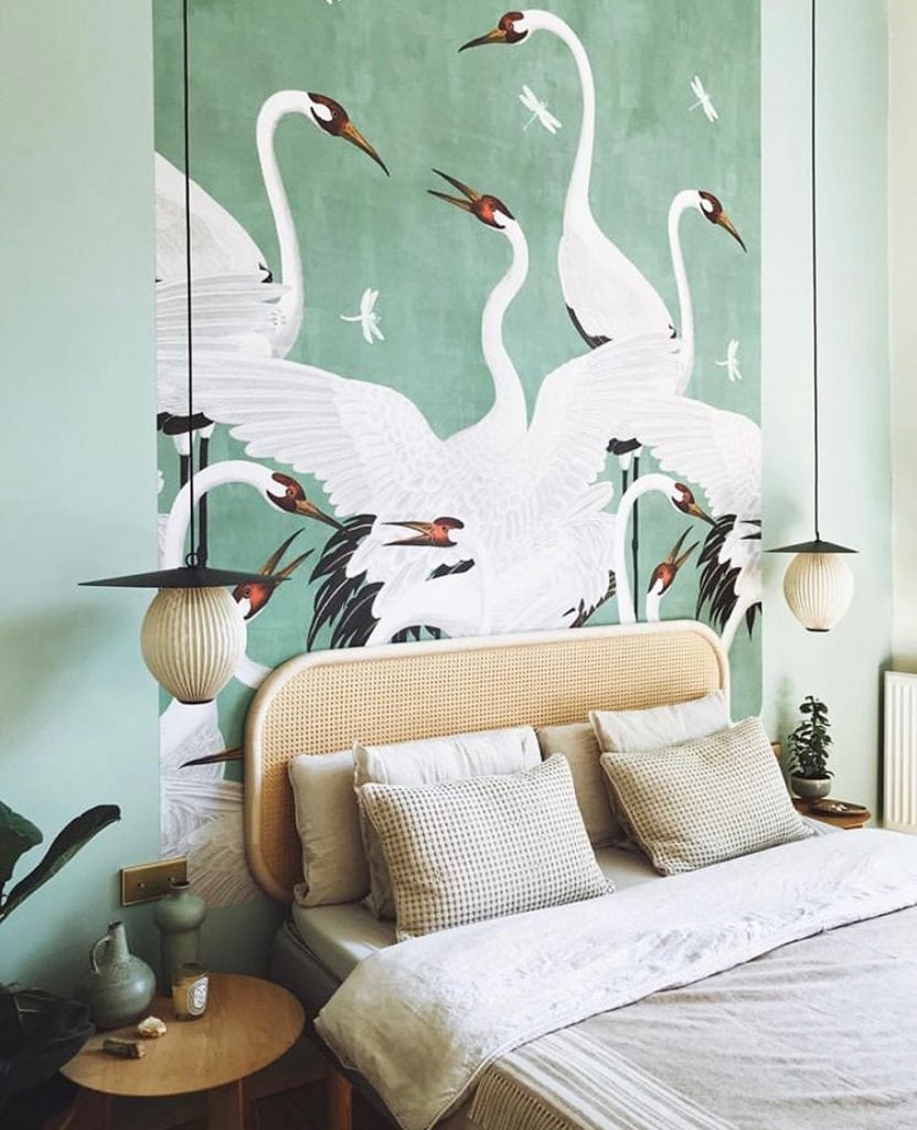 Green bedroom with Gucci green Heron wallpaper and cane headboard on Thou Swell #bedroom #bedroomdesign #interiordesign #heronwallpaper #gucciwallpaper #gucci