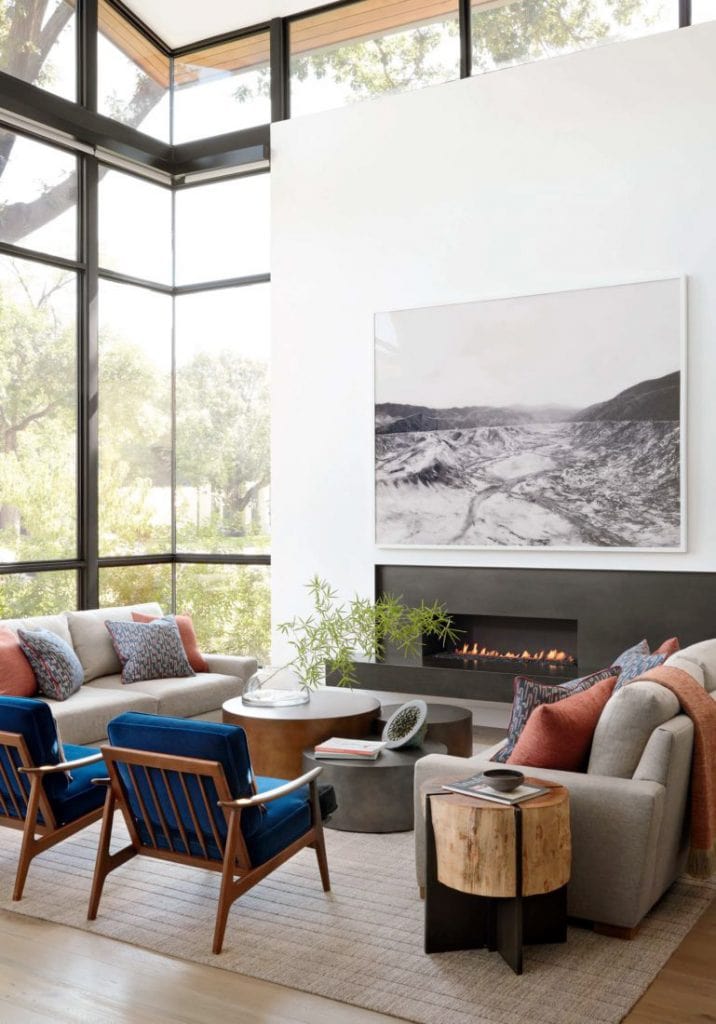 Living room with huge windows in modern Dallas home tour on Thou Swell #dallas #dallashome #hometour #homedesign #interiordesign #moderndesign #minimalist #minimaldesign #livingroom #livingroomdesign #modernlivingroom #midcenturydesign #mcm #midcenturylivingroom #midcenturyfurniture