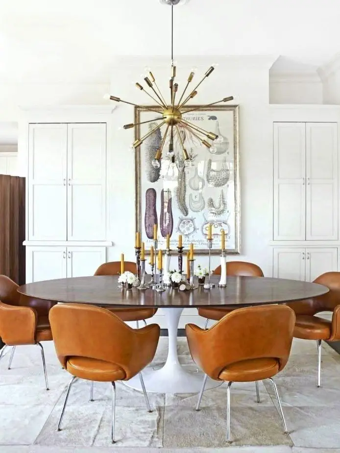 Design Within Reach founder dining room in Connecticut with tulip table and leather chairs on Thou Swell #diningroom #dining #moderndining #tuliptable #designwithinreach #housebeautiful