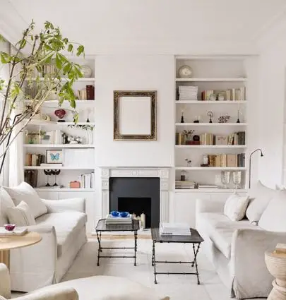 Cream living room design by Maria Santos Studio in spanish apartment in Madrid with facing sofas, linen sofas, cream rug, and greenery on Thou Swell #livingroom #livingroomdesign #creamlivingroom #creamdecor #interiordesign #homedesign