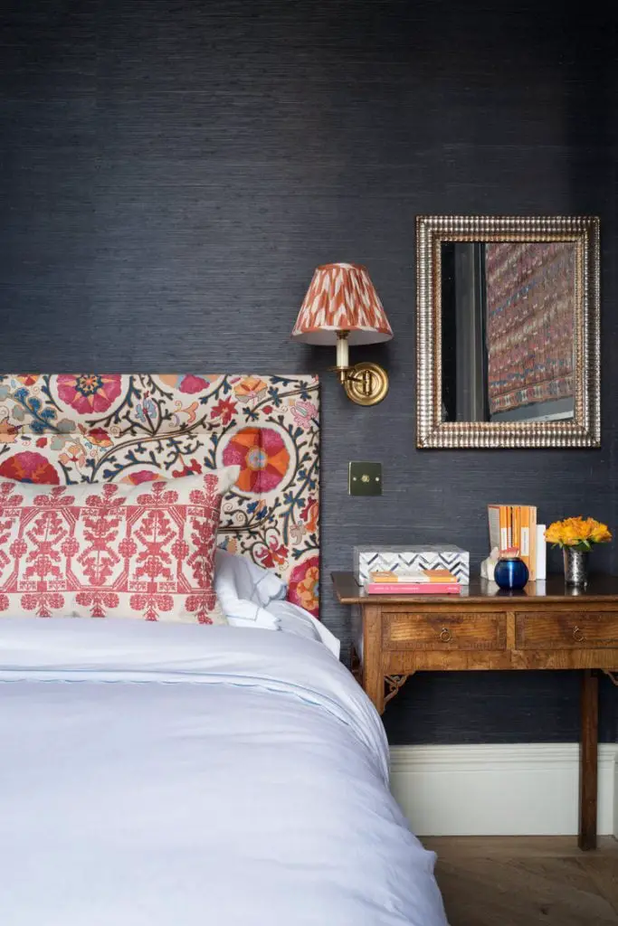 Dark grey grasscloth walls in English bedroom design with pattern headboard on Thou Swell #bedroom #bedroomdesign #interiordesign #homedesign #homedecor #britishdesign #englishdesign #headboard