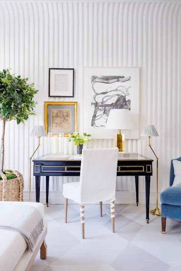 Stylish home office design desk decor with painted floor, gallery wall, and fluted walls on Thou Swell #homeoffice #desk #workfromhome #deskdecor #officedesign #officedecor #bedroomdesk #homedesign #homedecor