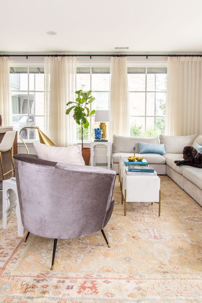 Modern living room accents from AllModern with cream velvet ottoman stools, grey velvet barrel chair, and vintage Turkish rug by Kevin O'Gara on Thou Swell #livingroom #livingroomdecor #modernaccents #allmodern #decor #homedecor #homedesign #livingroomdesign #interiordesign