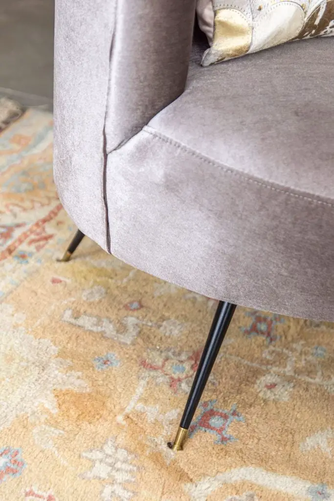 Modern living room accents from AllModern with cream velvet ottoman stools, grey velvet barrel chair, and vintage Turkish rug by Kevin O'Gara on Thou Swell #livingroom #livingroomdecor #modernaccents #allmodern #decor #homedecor #homedesign #livingroomdesign #interiordesign