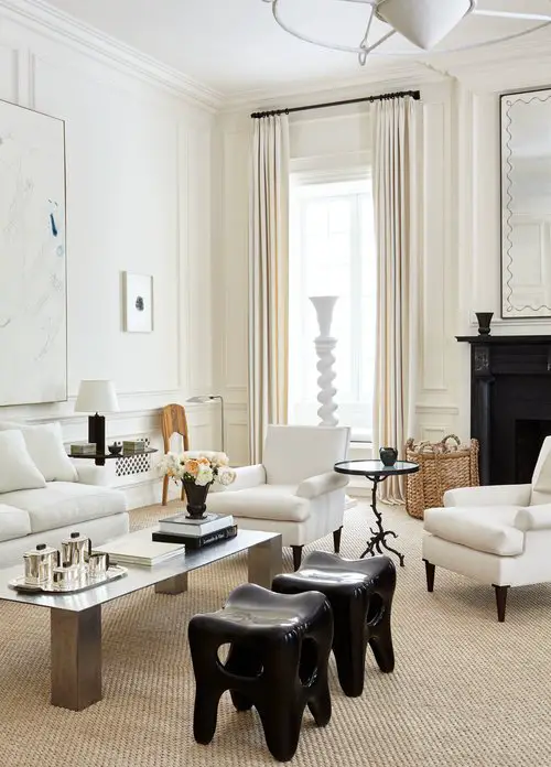 White living room design with layers of cream, tan, and black in New York townhouse with tall ceilings by Alyssa Kapito on Thou Swell #livingroom #livingroomdesign #interiordesign #oneroomchallenge #homedecor #homedecortips #livingroomgoals