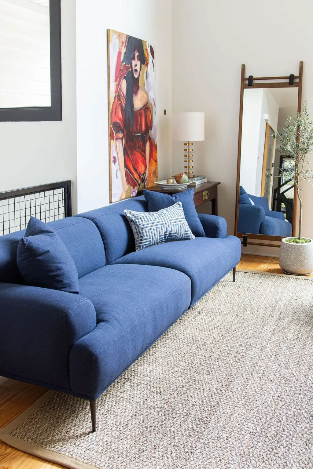 Modern living room design with blue sofa and armchair from Article, Abisko sofa and chair, navy blue sofa, townhouse design ideas by Kevin O'Gara on Thou Swell #article #myarticle #abiskosofa #bluesofa #moderndesign #livingroom #livingroomdesign #homedecor #homedecorideas