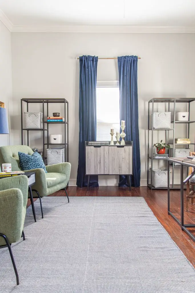 Home office makeover with the Queer Eye furniture line at Walmart, blue curtains, mid-century modern design, green armchairs, and charging desks by Kevin O'Gara on Thou Swell #queereye #queereyefurniture #office #homeoffice #homeofficedesign #homeofficemakeover #makeover #homemakeover #homedecor #homedecorideas #officedecor
