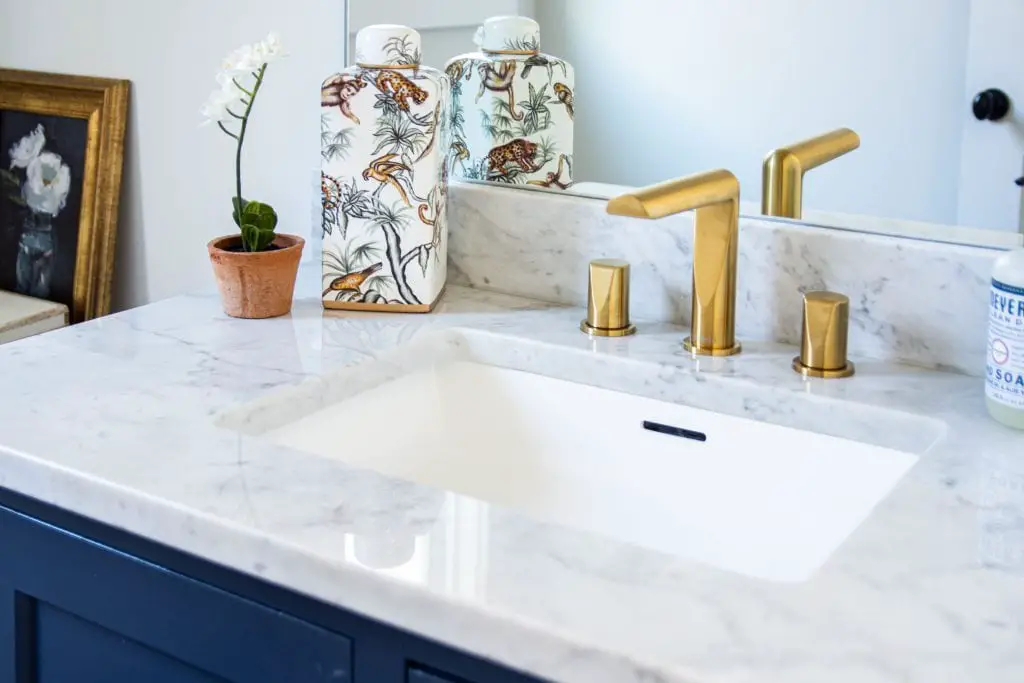 Riobel brushed gold Parabola faucet by House of Rohl in powder room bathroom design on Thou Swell #bathroom #powderroom #powderbath #bathroomdesign #goldfaucet #sinkfaucet #homedesign #bathroomideas #renovation #houseofrohl